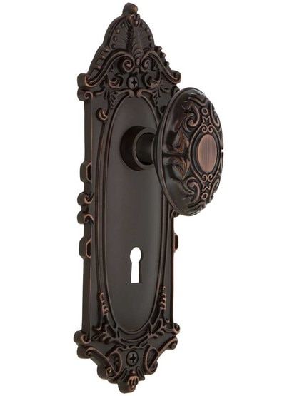 Largo Door Set with Decorative Oval Knobs and Keyhole in Timeless Bronze.